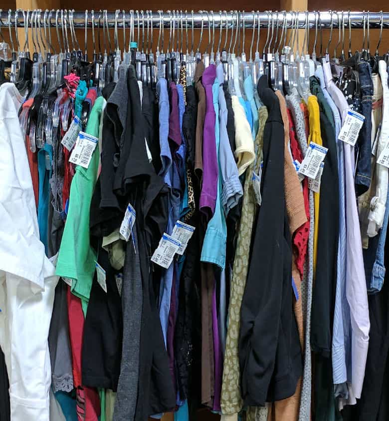 photo of clothes hanging on a rack
